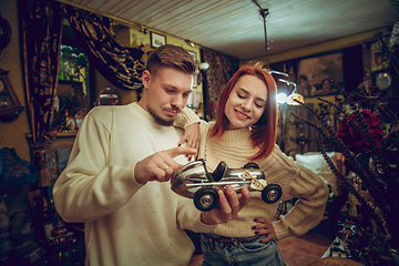 Image showing Smiling family, couple looking for home decoration and holiday\'s gifts in household store