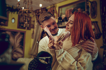 Image showing Smiling family, couple looking for home decoration and holiday\'s gifts in household store