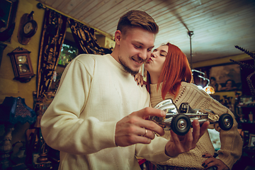 Image showing Smiling family, couple looking for home decoration and holiday\'s gifts in household store