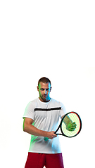 Image showing Man playing tennis isolated on white studio background in neon light, vertical flyer