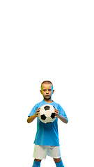 Image showing Young boy with soccer ball isolated on white studio background, vertical flyer with copyspace