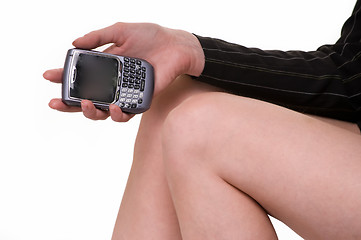 Image showing Hand holding a cell phone