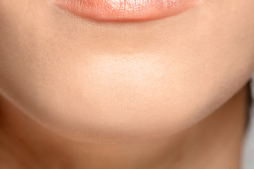 Image showing Close up portrait of beautiful jewish woman isolated on studio background. Beauty, fashion, skincare, cosmetics concept. Details.