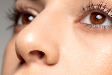 Image showing Close up portrait of beautiful jewish woman isolated on studio background. Beauty, fashion, skincare, cosmetics concept. Details.