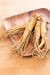 Image showing Ginseng over wooden background