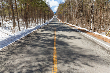 Image showing Traffic road in forest at winter time