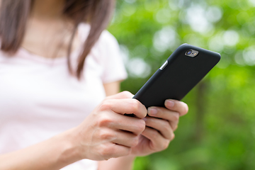 Image showing Woman hand using smart phone