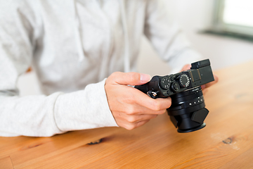 Image showing Woman using digital camera