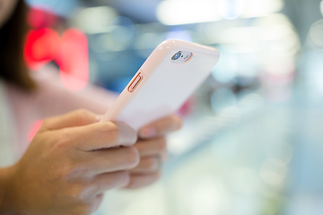 Image showing Woman browing internet on mobile phone