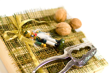 Image showing nutcracker, walnuts and decorations