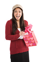 Image showing Surprised asian girl receiving valentine gift