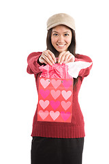 Image showing Asian girl carrying valentine gift