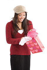 Image showing Asian girl opening valentine gift