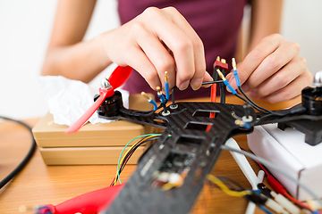 Image showing Building of flying drone with connecting cable