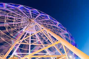 Image showing Ferris Wheel at amusement park during evening