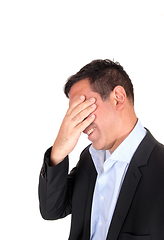 Image showing Business man covering is face for stress