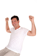 Image showing Happy man lifting his fists for excitement