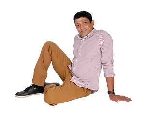 Image showing Relaxed East Indian man sitting on floor