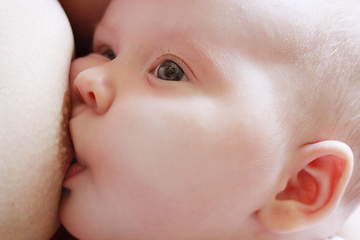 Image showing mother breastfeeding baby