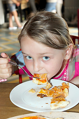 Image showing girl eating pizza