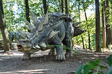 Image showing prehistoric dinosaur like stegosaurus in nature