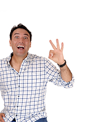 Image showing Happy young man signs OK with his finger