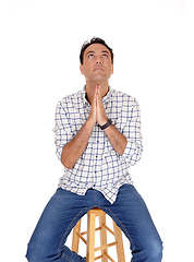 Image showing Young man praying with his hands folded