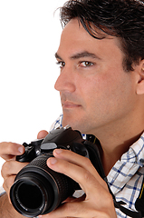 Image showing A young man holding his camera for a shoot