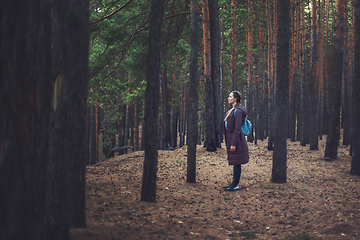 Image showing Woman in the autumn dark forest