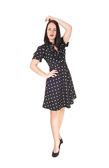 Image showing Beautiful woman walking in a pock dot dress