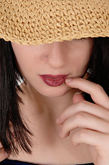 Image showing Mysterious woman with big straw hat in close up