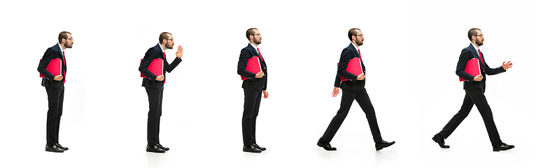 Image showing Handsome businessman with red folder in motion isolated over white studio background. Collage