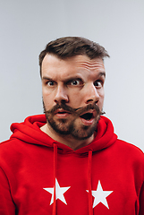 Image showing Young man with dual emotions combination on face isolated on white background, emotional and expressive