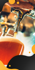 Image showing Hand of bartender pouring a large beer in tap. Vertical banner, flyer for ad.