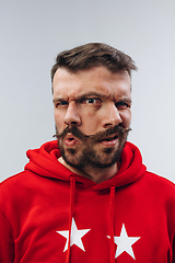 Image showing Young man with dual emotions combination on face isolated on white background, emotional and expressive