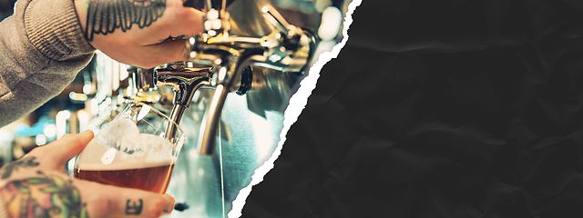 Image showing Hand of bartender pouring a large beer in tap. Horizontal banner, flyer for ad.