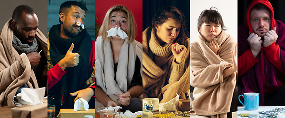 Image showing Young people wrapped in a plaid looks sick, ill, sneezing and coughing sitting at home indoors