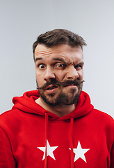 Image showing Young man with dual emotions combination on face isolated on white background, emotional and expressive