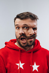 Image showing Young man with dual emotions combination on face isolated on white background, emotional and expressive