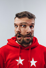 Image showing Young man with dual emotions combination on face isolated on white background, emotional and expressive