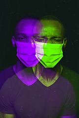 Image showing Close up portrait of african man wearing face mask background. Modern and trendy duotone effect, double exposure