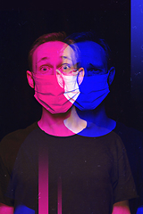 Image showing Close up portrait of caucasian man wearing face mask background. Modern and trendy duotone effect, double exposure