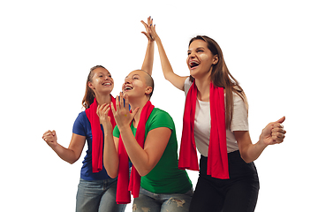 Image showing Female soccer fans cheering for favourite sport team with bright emotions isolated on white studio background