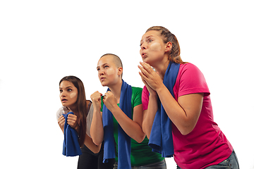 Image showing Female soccer fans cheering for favourite sport team with bright emotions isolated on white studio background