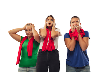 Image showing Female soccer fans cheering for favourite sport team with bright emotions isolated on white studio background