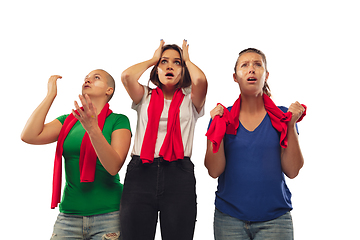 Image showing Female soccer fans cheering for favourite sport team with bright emotions isolated on white studio background