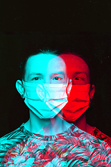 Image showing Close up portrait of caucasian man wearing face mask background. Modern and trendy duotone effect, double exposure