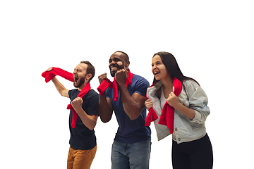 Image showing Multiethnic soccer fans cheering for favourite sport team with bright emotions isolated on white studio background