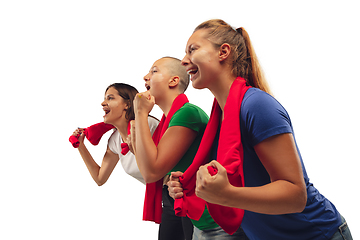 Image showing Female soccer fans cheering for favourite sport team with bright emotions isolated on white studio background