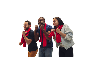 Image showing Multiethnic soccer fans cheering for favourite sport team with bright emotions isolated on white studio background